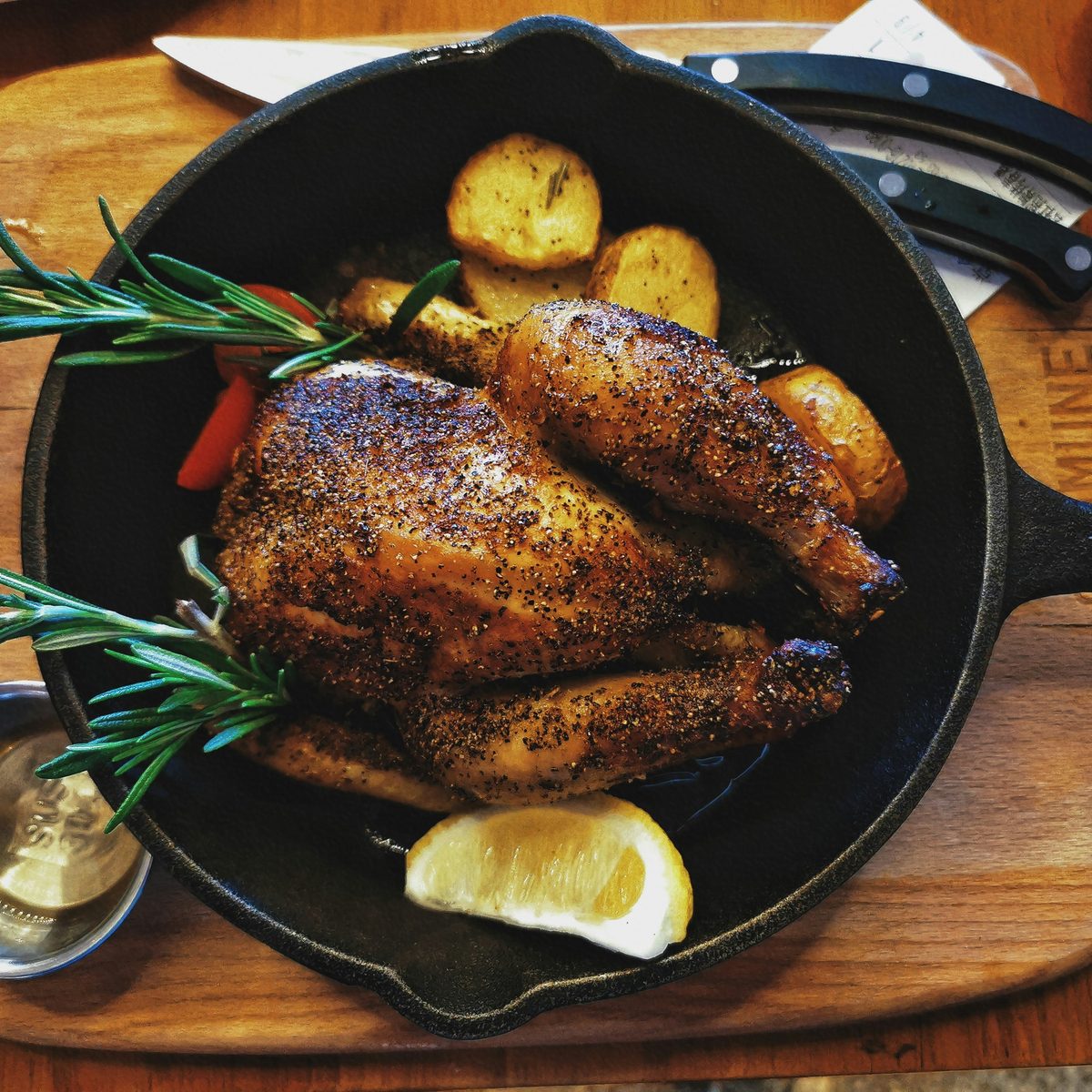 Pepper-crusted chicken in a cast-iron skillet